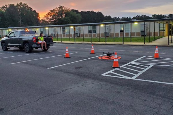 Drone setup in parking lot at dusk for aerial thermal imaging