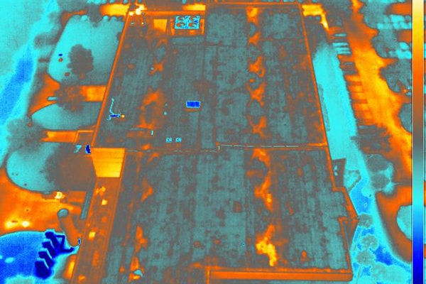 Thermal infrared aerial image of commercial rooftop showing heat patterns